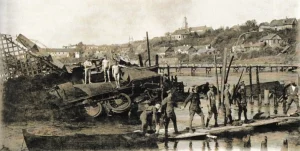 1920, Гродно. Разрушенный железнодорожный мост через Неман, уничтоженный бронепоезд, на заднем плане деревянный мост, построенный польскими саперами. Фото: Hrodna 11:27